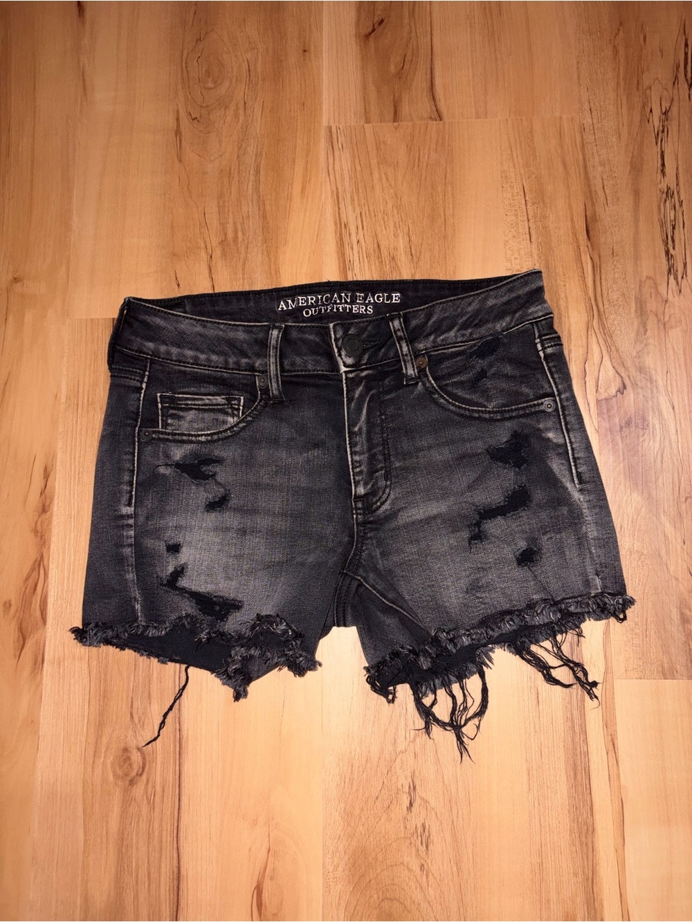 American Eagle Outfitters distressed black denim cut-off shorts